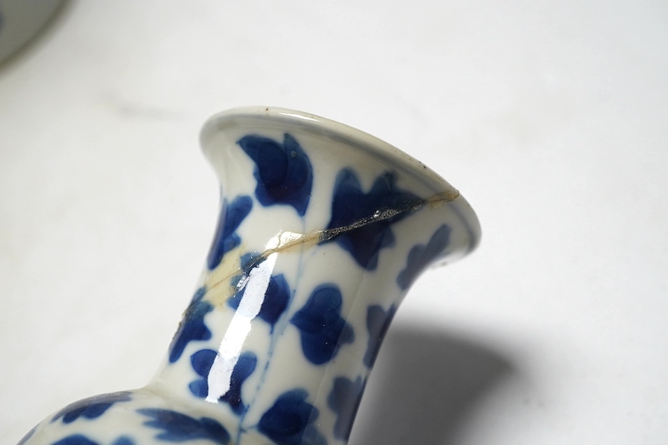A pair of Chinese blue and white cylindrical brushpots and a smaller pair, tallest 29cm. Condition - both smaller vases with heavy repairs
